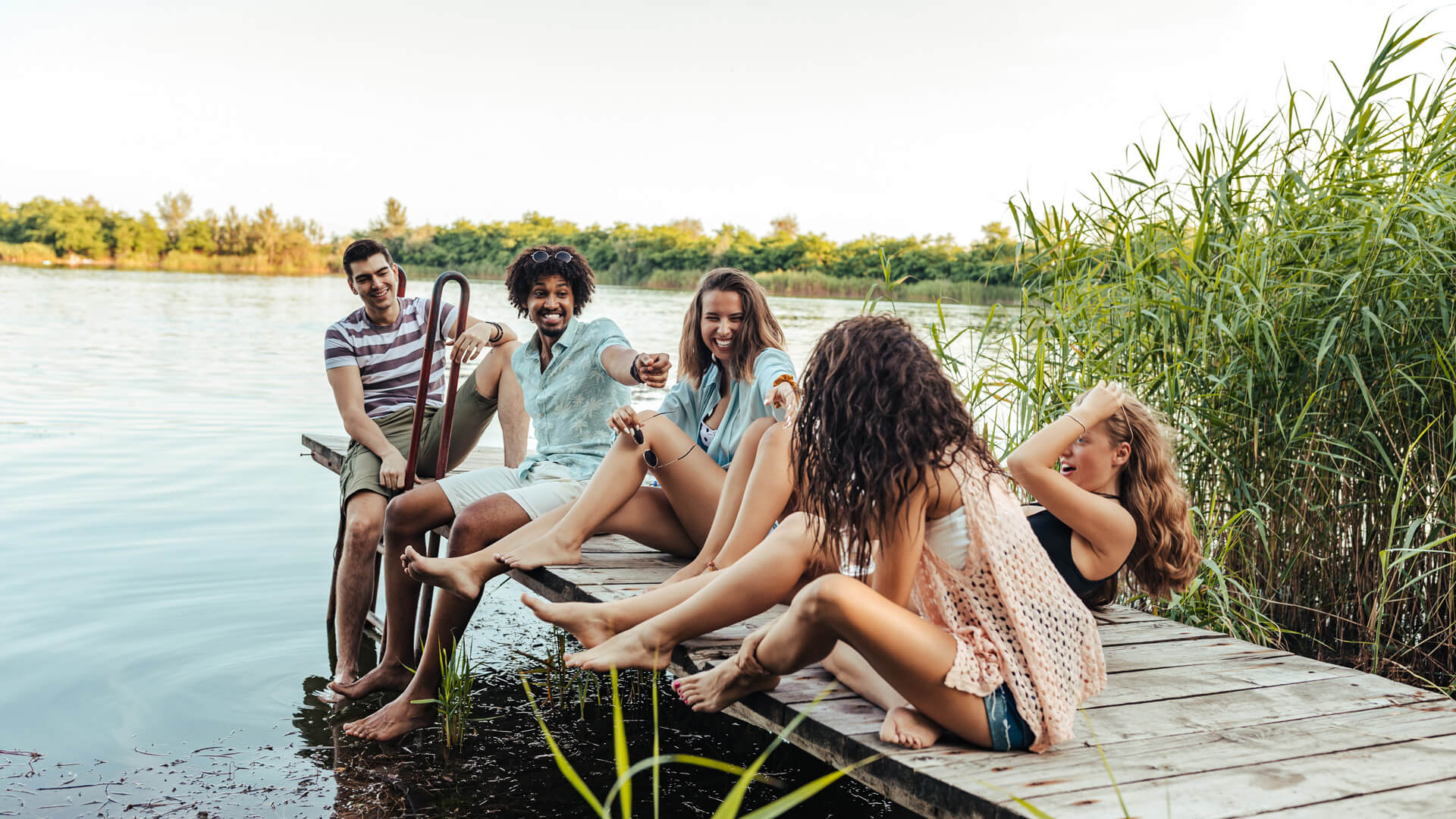 a group of friends on a dock smiling