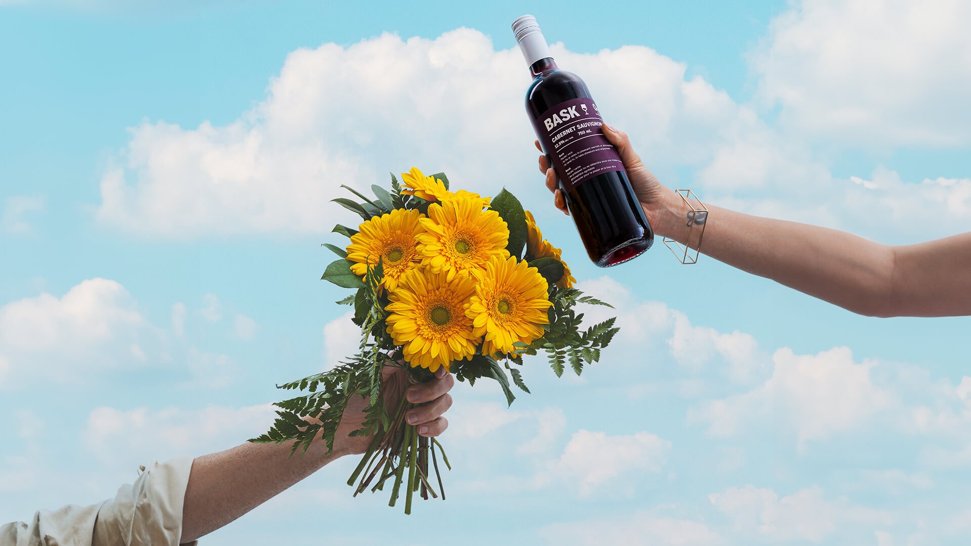 A bottle of Bask Cabernet Sauvignon with a Mother's Day bouquet.