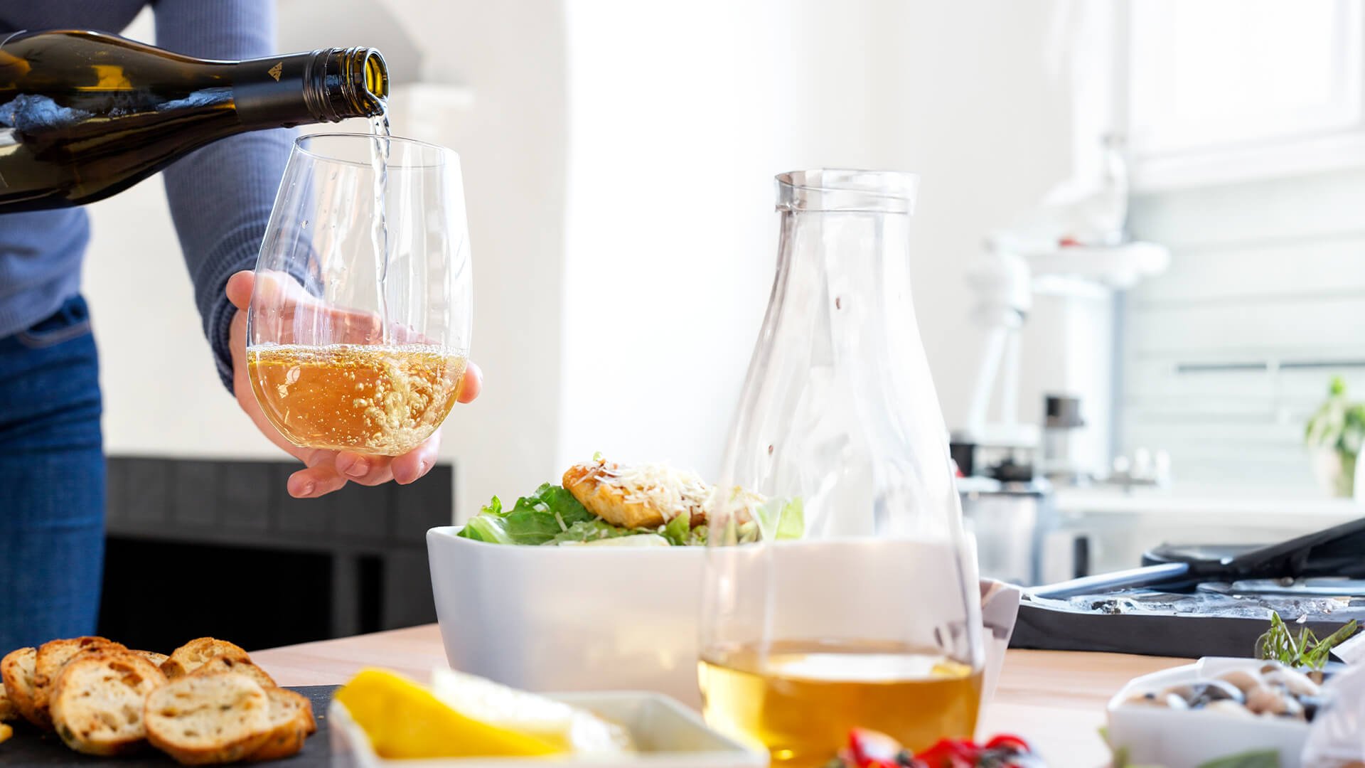 White wine being served with salad.