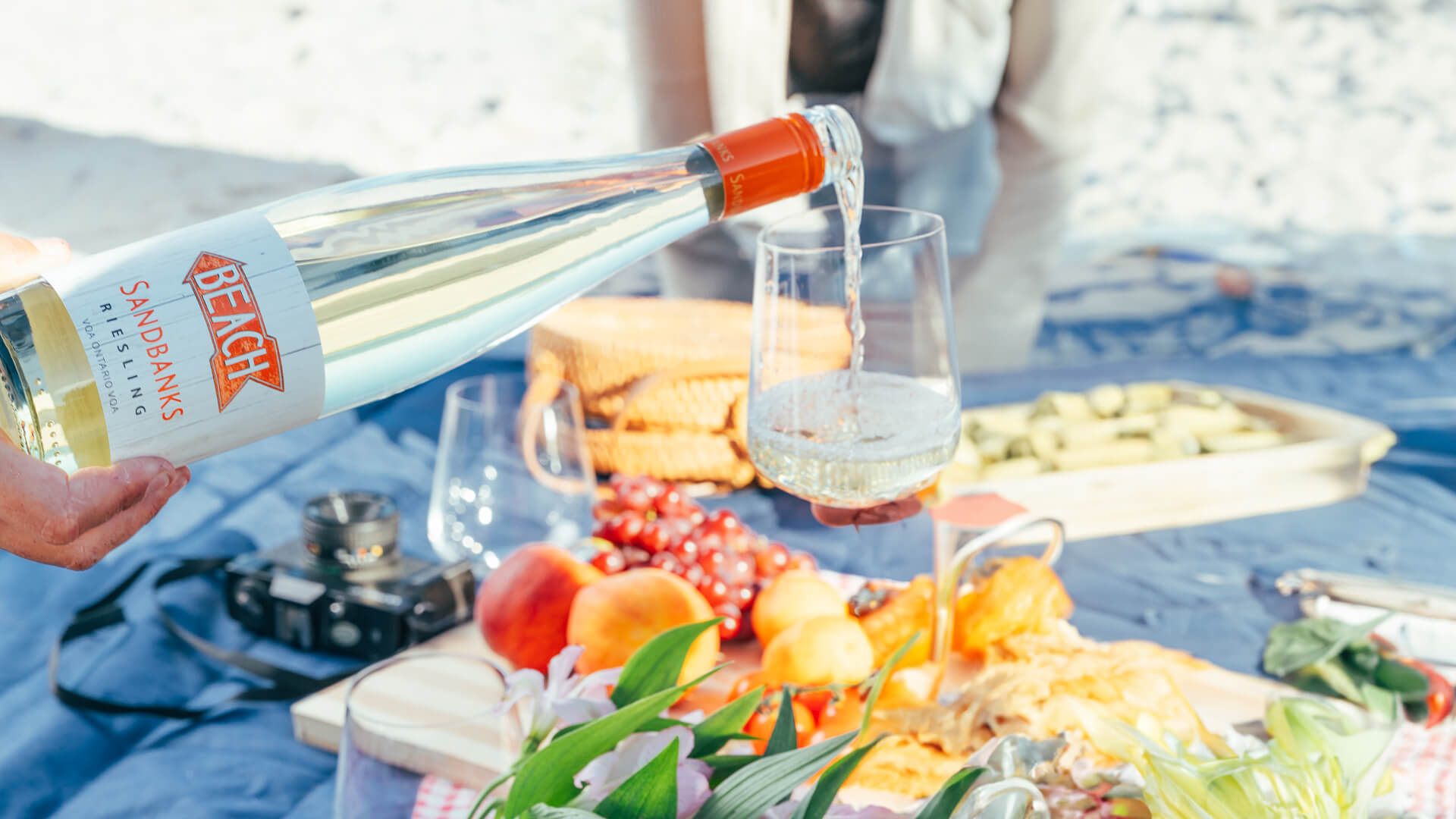 A bottle of Sandbanks Riesling being served.